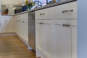 White cabinets in blue kitchen