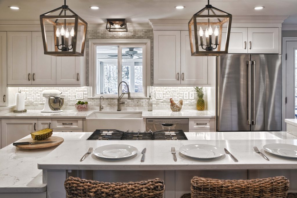 Modern white kitchen with hanging lights