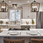 Modern white kitchen with hanging lights