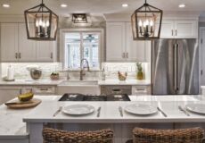 Modern white kitchen with hanging lights